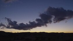 Wide shot of clouds flying over desert landscape / Moab, Utah, United States Stock Footage