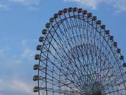 CU Turning ferris wheel with moving clouds at dusk / Yokohama, Kanagawa, Japan Stock Footage