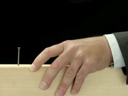 HD Super Slow-Mo: Businessman Hitting A Nail On The Head Stock Footage