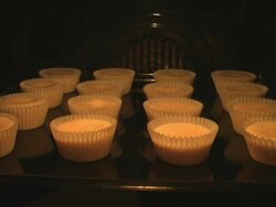 Muffins growing in the oven Stock Footage