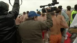Hundreds of swimmers take to icy water for traditional New Year dip News Clip