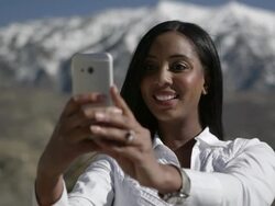 Woman using smartphone to make a call while outside. Stock Footage