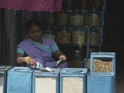 MS Woman grain vendor at street market / Patna, Bihar, India Stock Footage