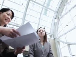  LA Business associates in a meeting passing documents / Seattle, Washington, United States Stock Footage