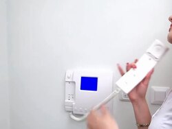 Blonde woman talking on the video intercom Stock Footage