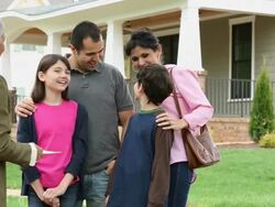 WS DS Family Shaking Hands with Realtor in Front of New Home For Sale / Richmond, Virginia, USA Stock Footage