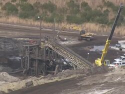 AERIAL WS Bulldozer moving on dirt road at Heavy metal mines/ Florida, United States Stock Footage