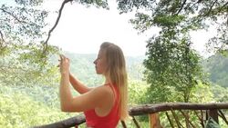 Woman using Smart Phone to take a Photograph. Stock Footage