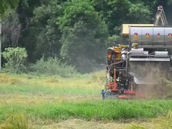 Tractor harvesting rice Stock Footage
