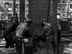 B/W 1930/31 construction workers pound nails in Empire State Bldg. foundation / NYC / industrial Stock Footage