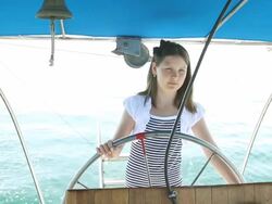 Girl driving a yacht Stock Footage
