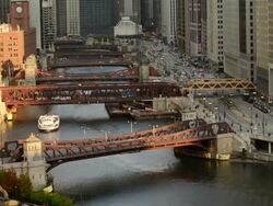 WS HA View of river and wacker drive showing boat and motor vehicle traffic / Chicago, Illinois, United States Stock Footage