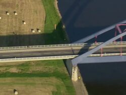 MS AERIAL ZO Shot of man walking at new bridge on Elbe river / Germany Stock Footage