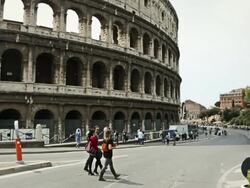 Coliseum of Rome, or Colosseo: tourists  walking around Stock Footage