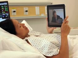 "patient in hospital talking to co-worker on skype/Richmond,Virginia, USA" Stock Footage