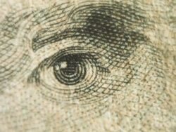 Pan to a close up of Andrew Jackson's eyes on the $20 bill. Stock Footage