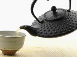 Pouring green tea from tetsubin pot - white background (HD720p) Stock Footage