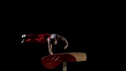 SLO MO DS Male gymnast doing cartwheel spring on vault Stock Footage