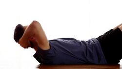 Sit-ups, young male. Stock Footage