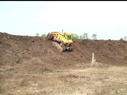 Workers are racing to protect an Iowa town from the rising Missouri River by adding several feet of dirt to a temporary levee.   The situation grew worse when the river punched through a second levee, the town's main protection. News Clip