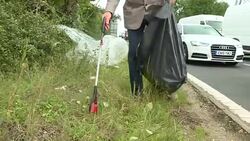 Anon Man Picking Up Litter from Roadside News Clip