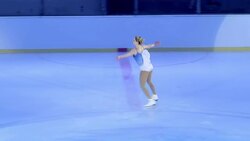 SLO MO TS Female figure skater performing a jump Stock Footage