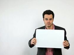Sales Guy Holding White Board, Being Silly. Stock Footage