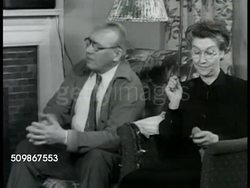 1946: LIVING WITH IN-LAWS: DRAMATIZATION: INT Home living room w/ young couple & child, elder male talking (no SOT) grandmother scolding child for tipping lamp over (no SOT), mother holding child, elder female walking out of room. Instructional Video