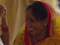 MS ZO Woman smiling in Mausoleum of Nizamuddin Dargah, area of Sufi Saint / New Delhi, Delhi, India Stock Footage