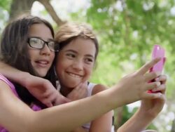 Best Friends Making Silly Faces at Smart Phone Clip 3 Stock Footage