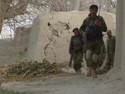 MS Soldier holding rifle and walking in desert / Mausa Qala, Helmand Province, Afghanistan. Stock Footage