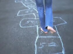 MS Girl drawing on sidewalk with colored chalk / Langley, British Columbia, Canada.  Stock Footage