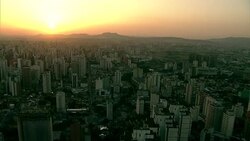 The sun colors the sky pink over the metropolis of Sao Paulo, Brazil. Stock Footage
