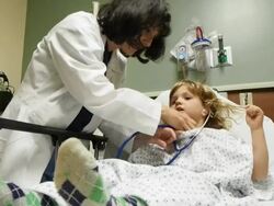 Doctor Working With Child Stock Footage