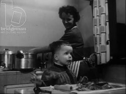A mother's evening routine, c.1960 Stock Footage