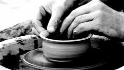 man creates pottery on a potter's wheel Stock Footage