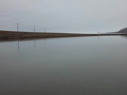 Magnificent arctic landscape with a lake and empty road on the Spitsbergen island, Svalbard archipelago Stock Footage
