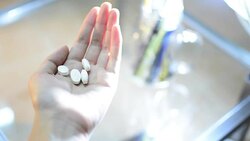 Hands Pressing Pill out of medicine bottles Stock Footage