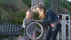 MS Mother and daughter fixing a bicycle together Stock Footage