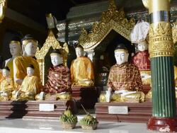 MS Buddha statues wearing colorful robes in shwedagon pagoda / Yangon, Yangon Division, Myanmar Stock Footage