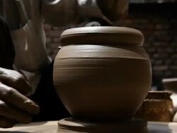 Man making a earthen pot on a pottery wheel  Stock Footage