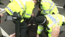 Police Officers Moving Anti-Austerity Protester News Clip