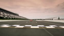 Three stock-car drivers cross finish line (Head-On) Stock Footage
