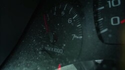 A tachometer registers engine speed on a snowy vehicle. Stock Footage