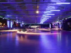W/S Bumper cars, night, light trails Stock Footage