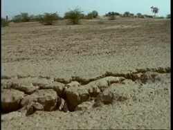 MS Low angle pan left, Along fault line in desert, Gujarat, India Stock Footage