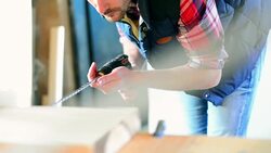 Drilling holes in a wood plank. Stock Footage