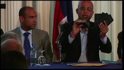 Martelly shows passport and denies accusations he gave up citizenship News Clip