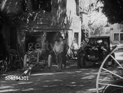 1950: BEAULIEU: DORDOGNE VALLEY:  VS Male carving wooden shoe in shop. VS Blacksmith checking machinery, fire burning in bellow, blacksmith fanning, males hammering burning iron. France, country, rural, lifestyle, forger Instructional Video