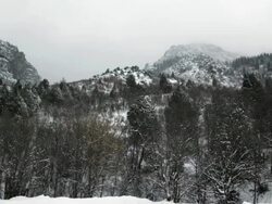 WS PAN View of snow falling on mountains / Payson, Utah, USA Stock Footage